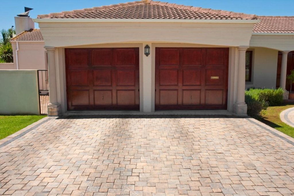 house with double wooden garage doors