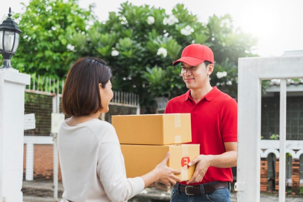 man delivering boxes to woman