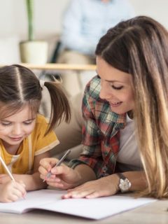 mom helping daughter with homework