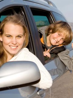mom and son in a rental car