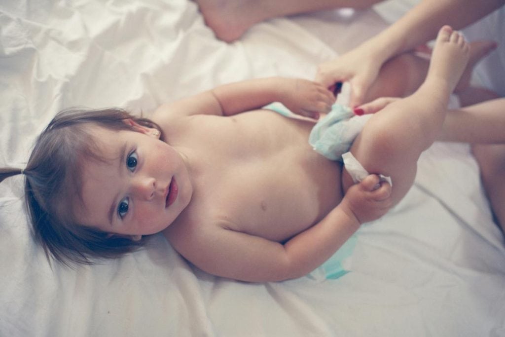 baby girl getting a diaper change