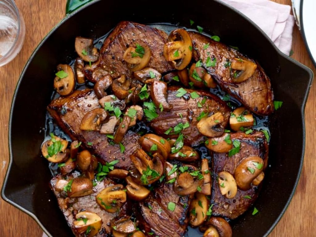balsamic glazed steak tips in cast iron pan