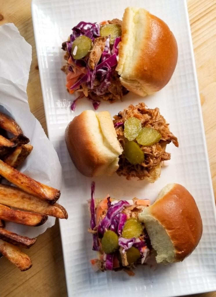 crock pot pulled pork sliders on white rectangular dish