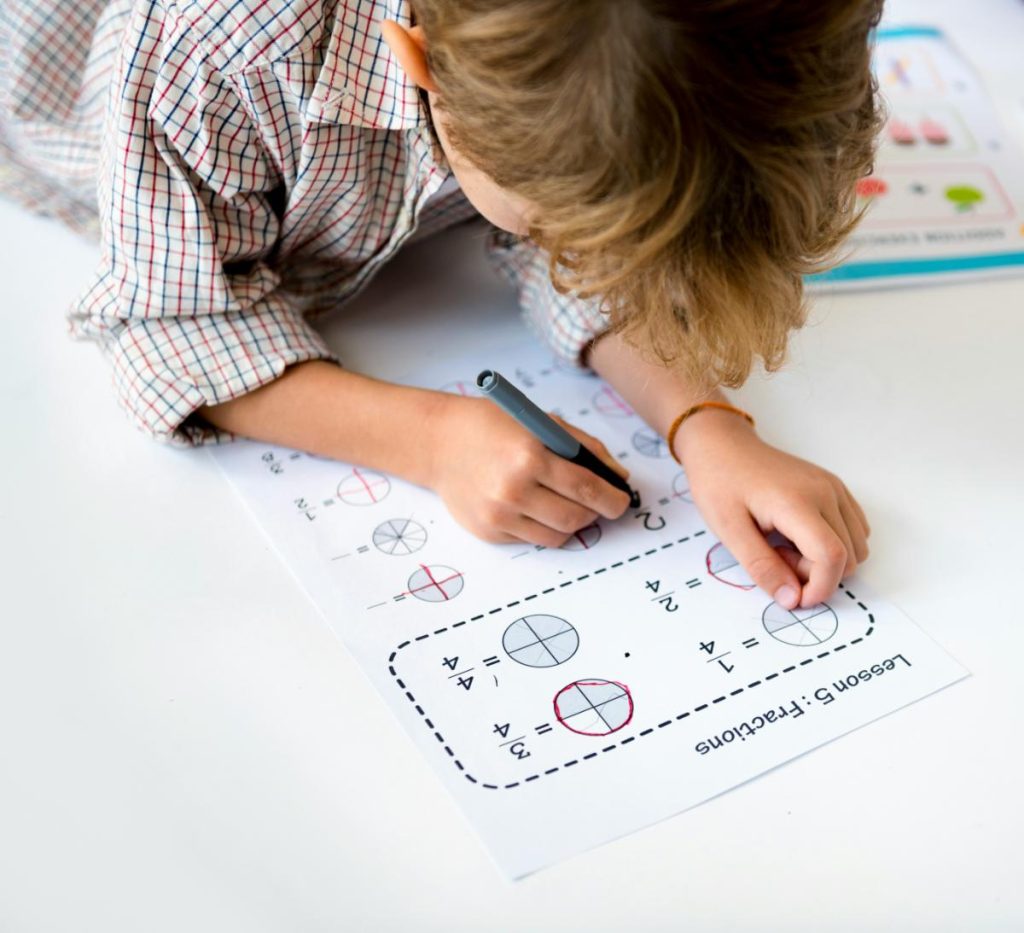 child working on fractions