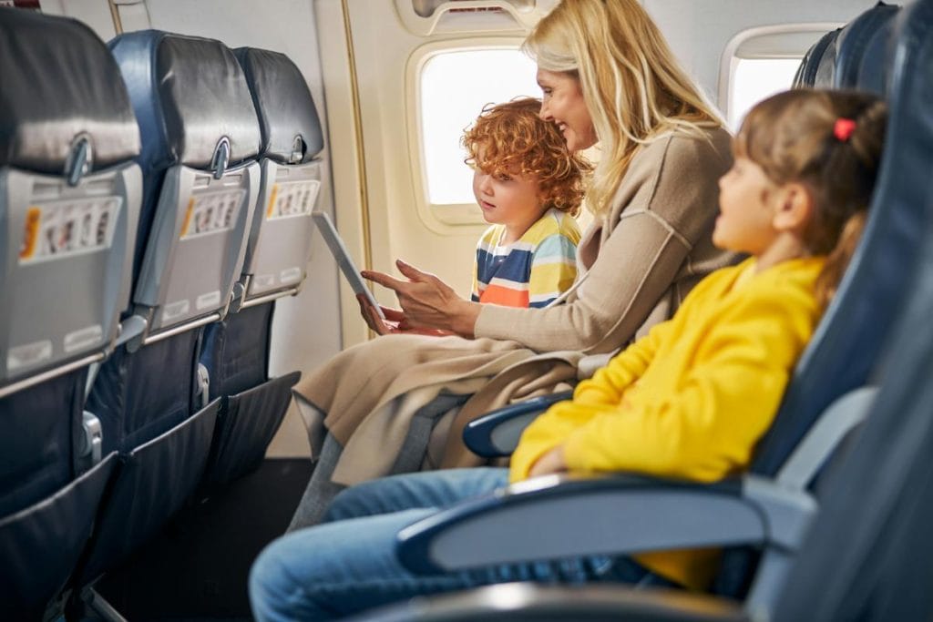 mom and kids on airplane