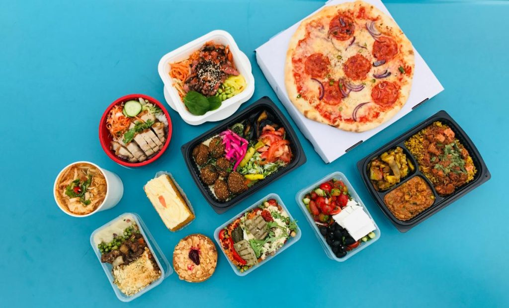 various family-friendly foods on teal background