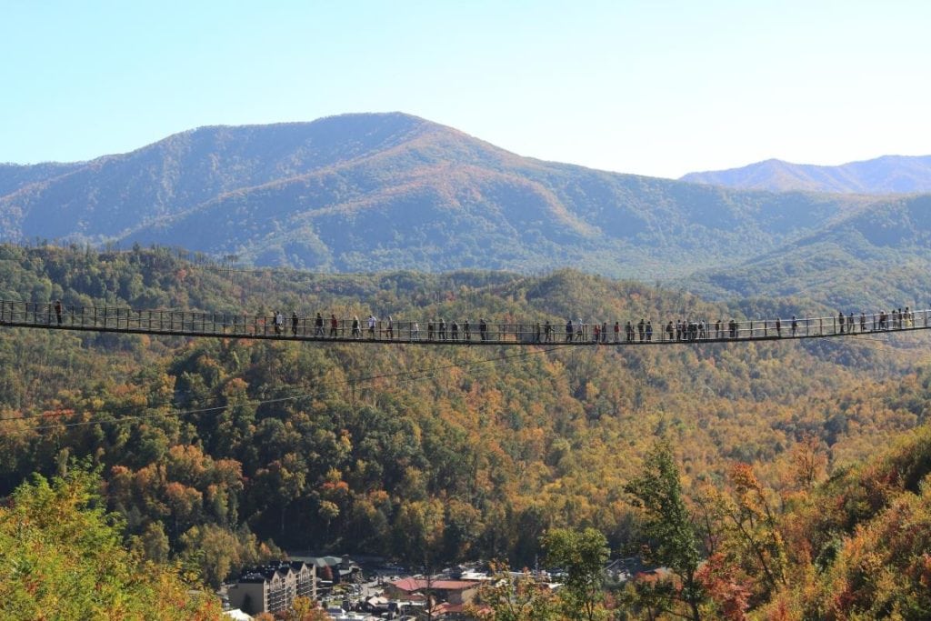 people walking across the skybridge in Gatlinburg in the daytime