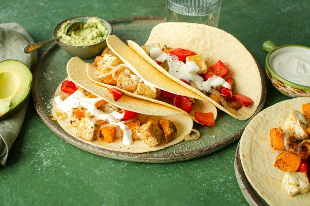 tofu tacos on green background