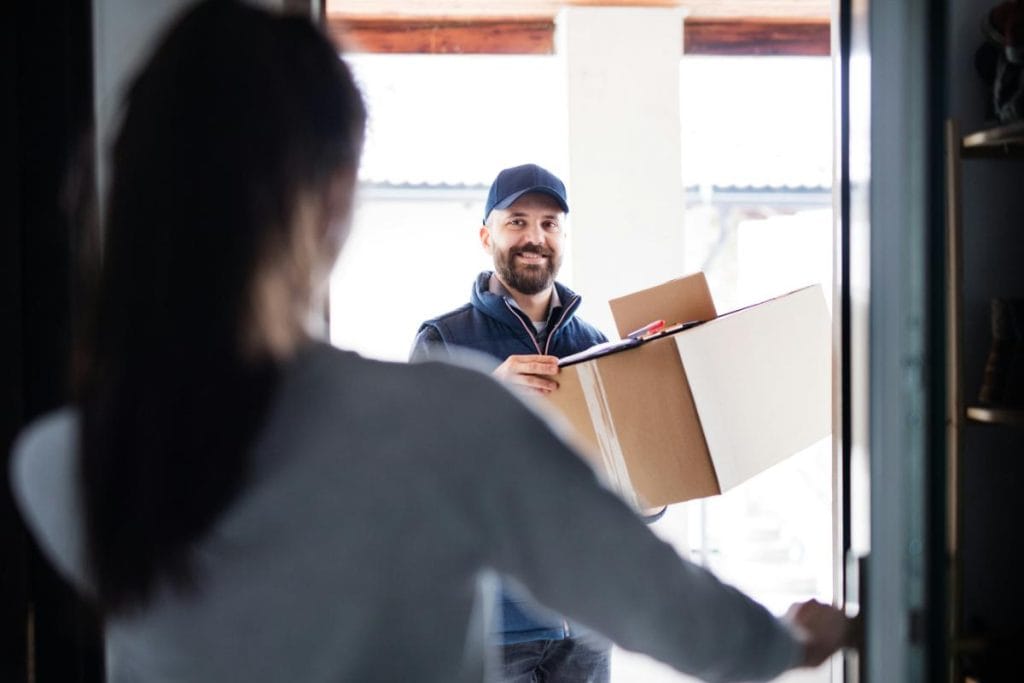 woman at door receiving a package