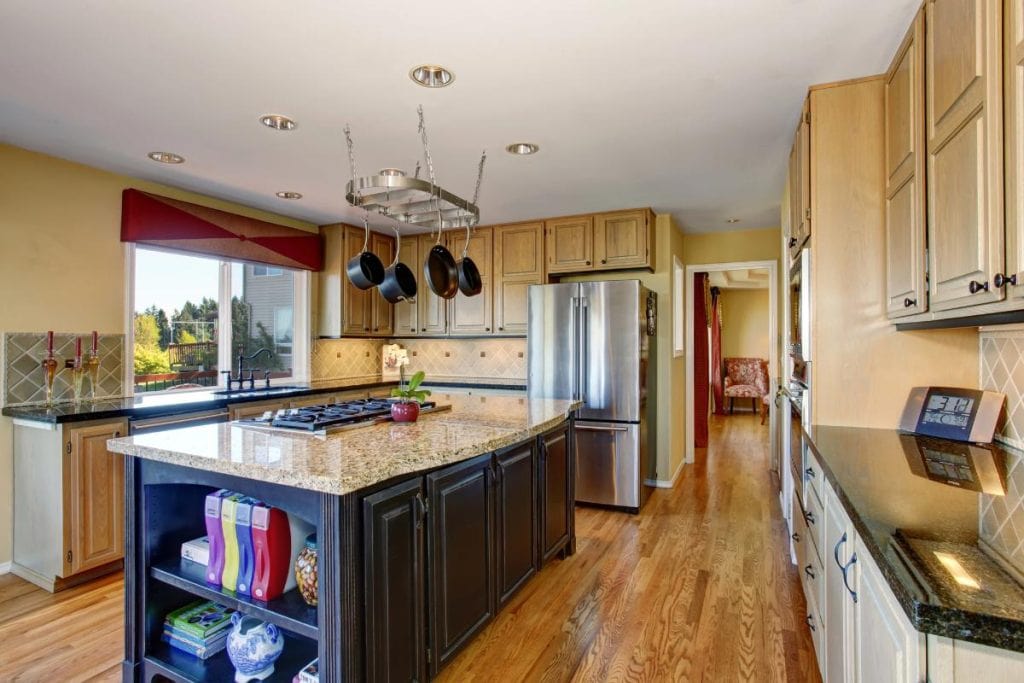 a kitchen with hardwood floors