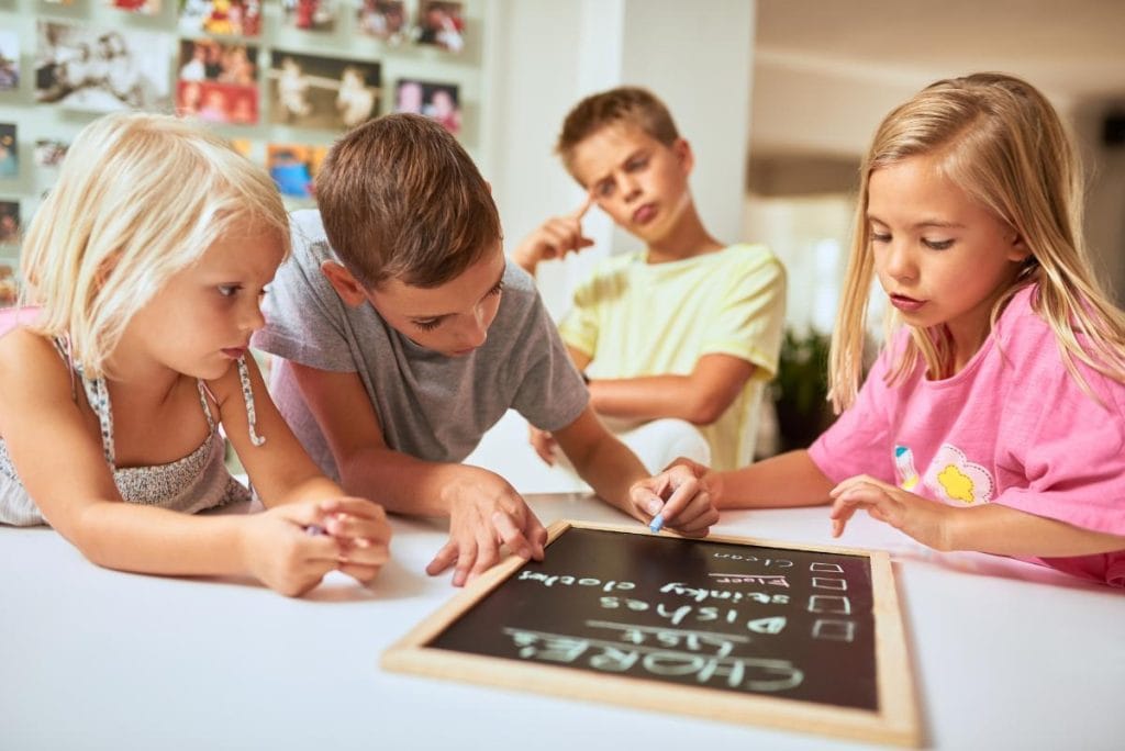 kids looking at a list of chores