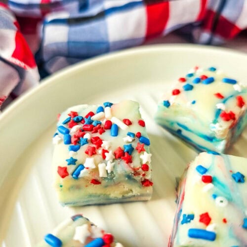 Zoomed-in shot of star-sprinkled red, white, and blue fudge showcasing vibrant colors and a soft texture—great for summer cookouts or 4th of july parties.