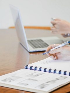 woman taking notes in a notebook