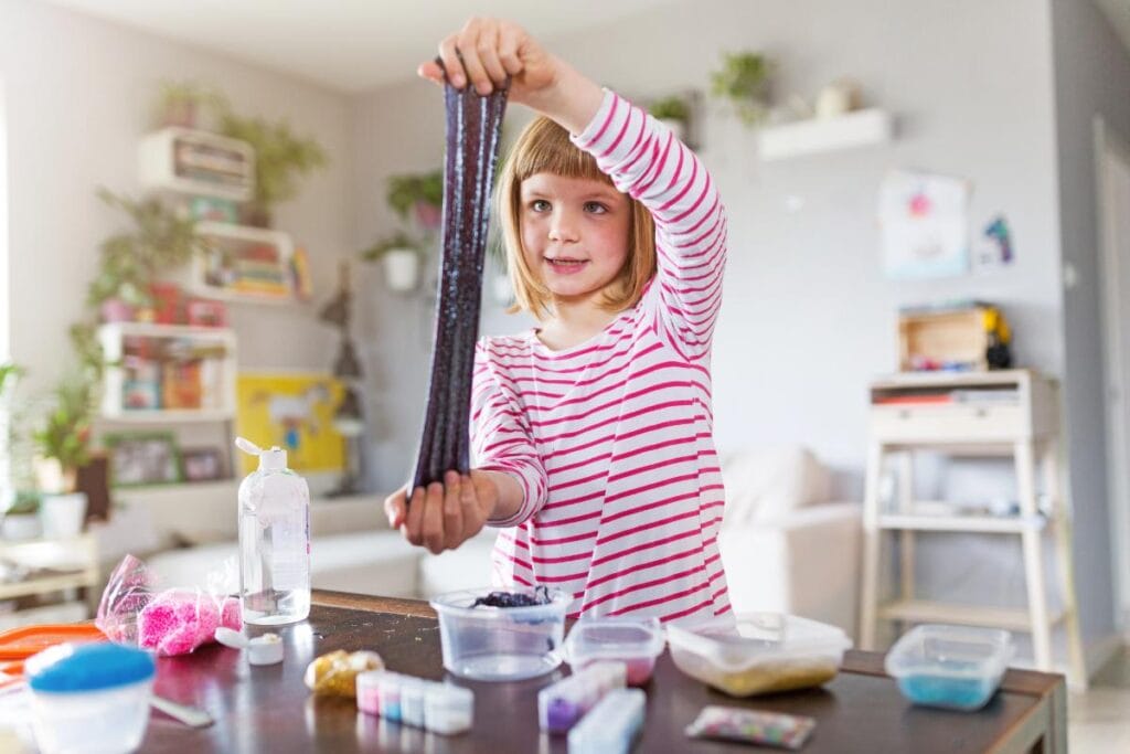 girl stretching homemade slime