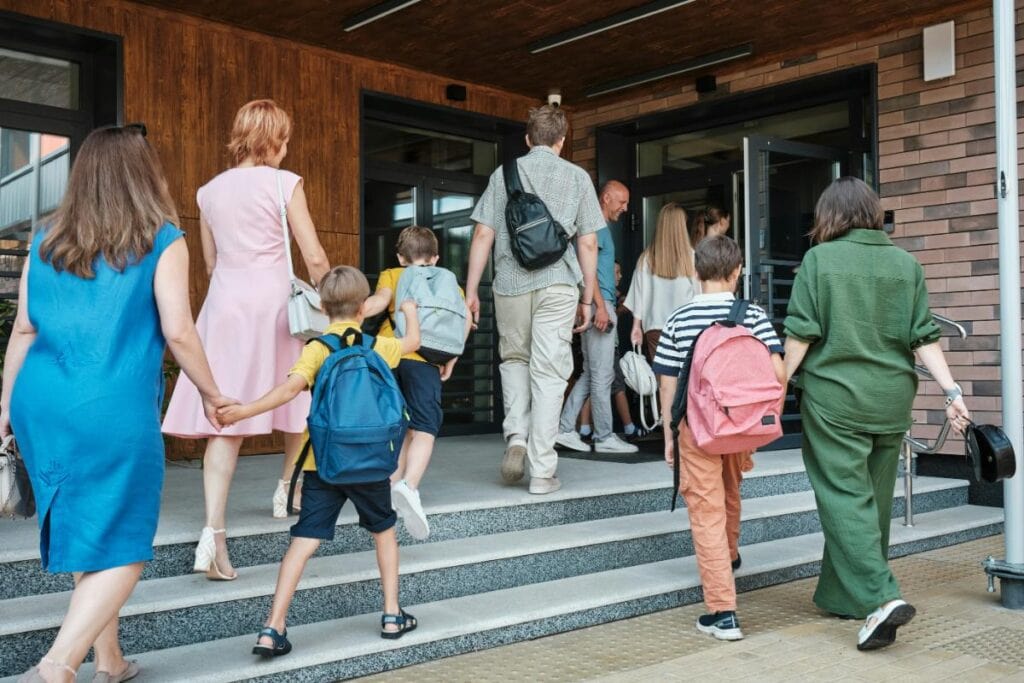 parents walking their kids into school