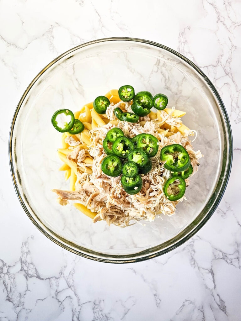 Sliced jalapeños mixed into the chicken and pasta before baking the casserole.