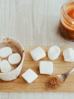 Cozy non-coffee drink for kids featuring hot chocolate with marshmallows, perfect for home café setups and warm family moments.