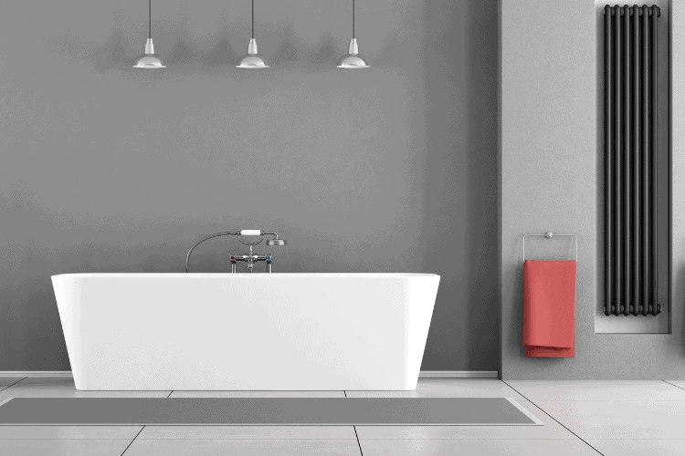 a gray minimalist bathroom mockup design with black radiator for heating