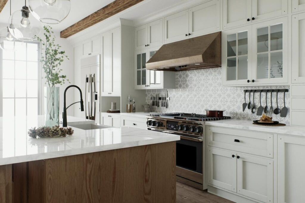 Close-up view of a remodeled kitchen showcasing a white and wood island with black faucet, stainless steel range, patterned tile backsplash, and efficient storage for a modern, functional layout.
