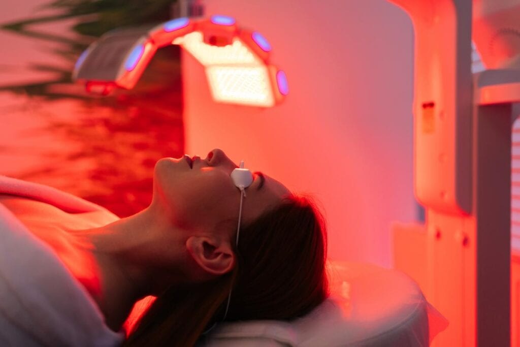 woman undergoing red light therapy