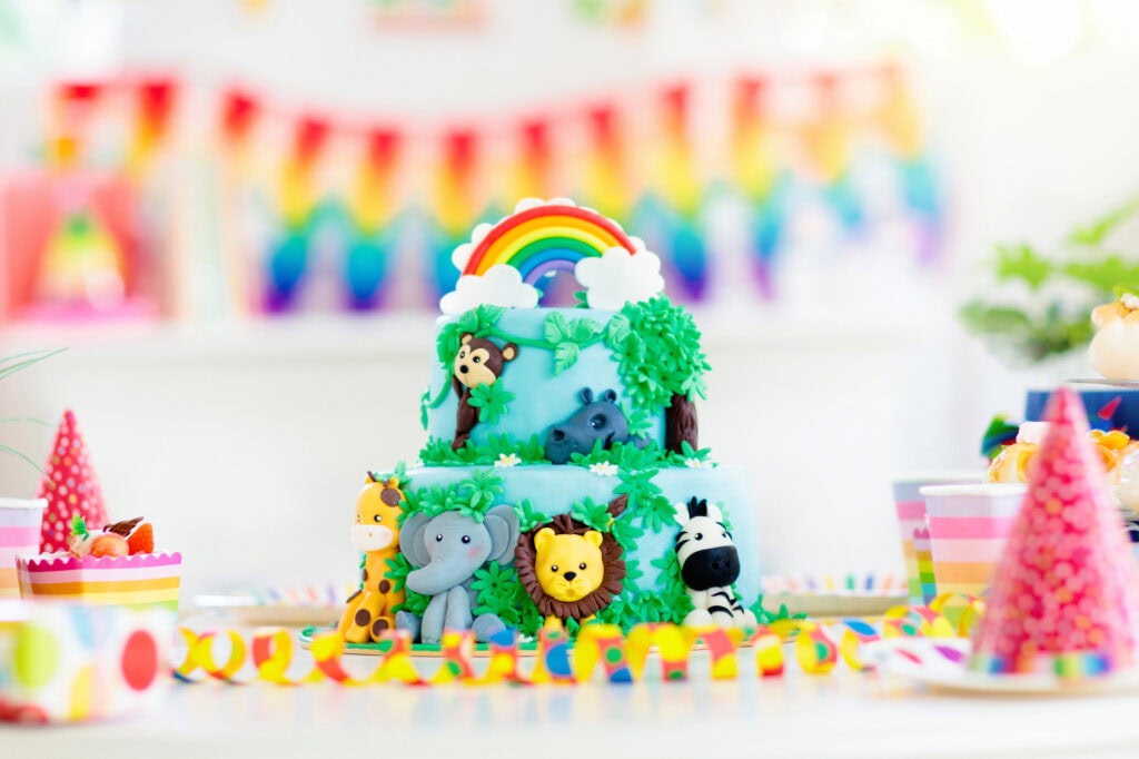 vibrant colorful safari birthday party cake