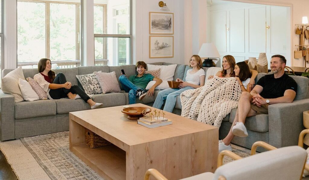 Family relaxing on gray sectional in a modern living room