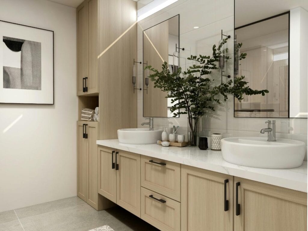 A stylish renovated bathroom with light wood cabinetry, double vessel sinks, black hardware, and large mirrors, creating a serene and modern space.