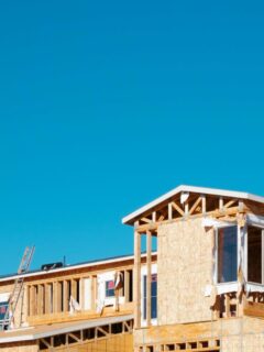 large new home under construction against a blue sky