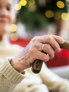 elderly woman holding cane