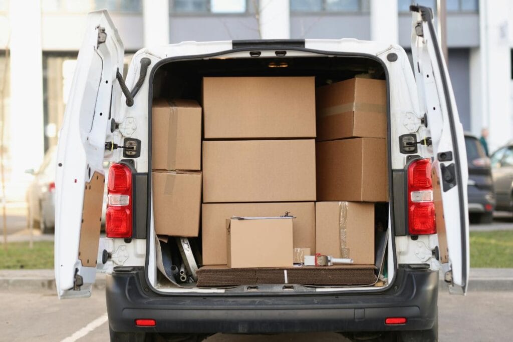 white van full of moving boxes