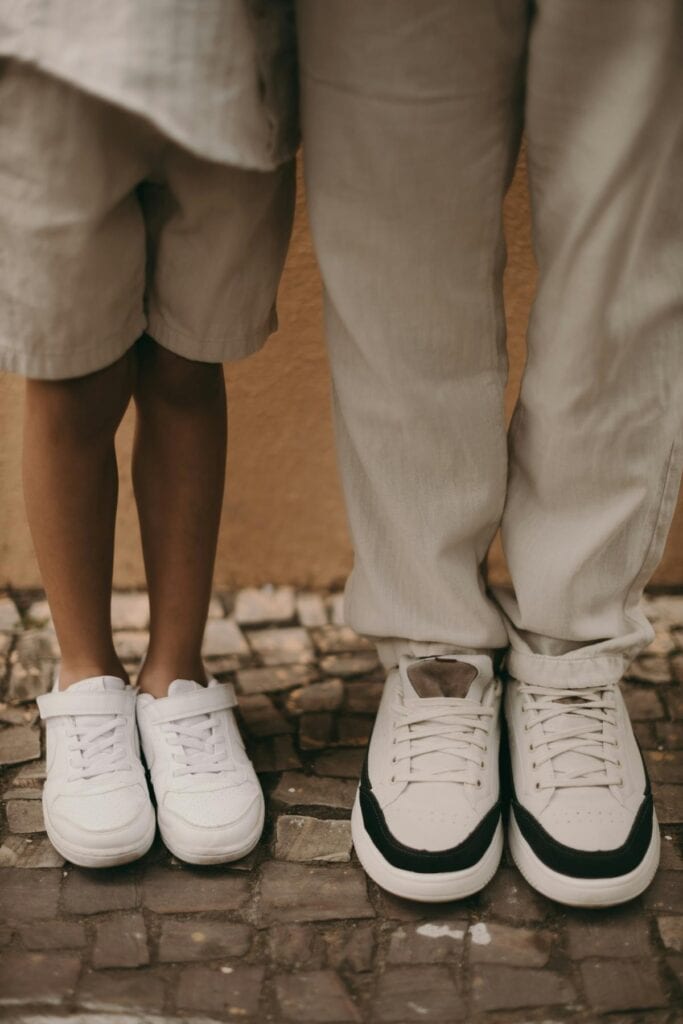 Child and adult standing side by side in low-profile sneakers, showcasing versatile style for everyday family wear