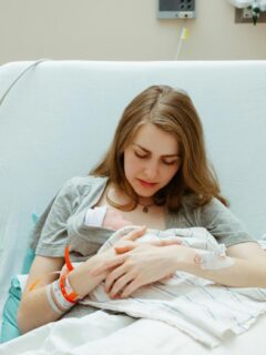 woman holding her baby after a hospital delivery