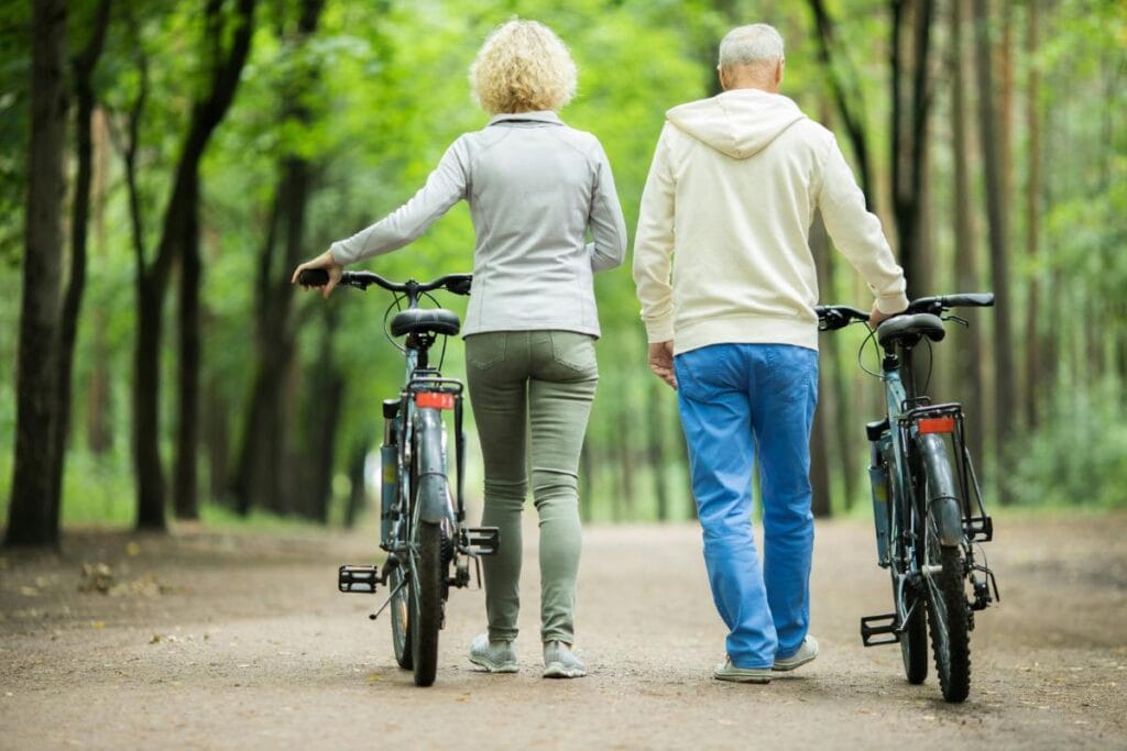 a senior couple on a quiet road with bicycles