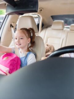 mom driving daughter to school
