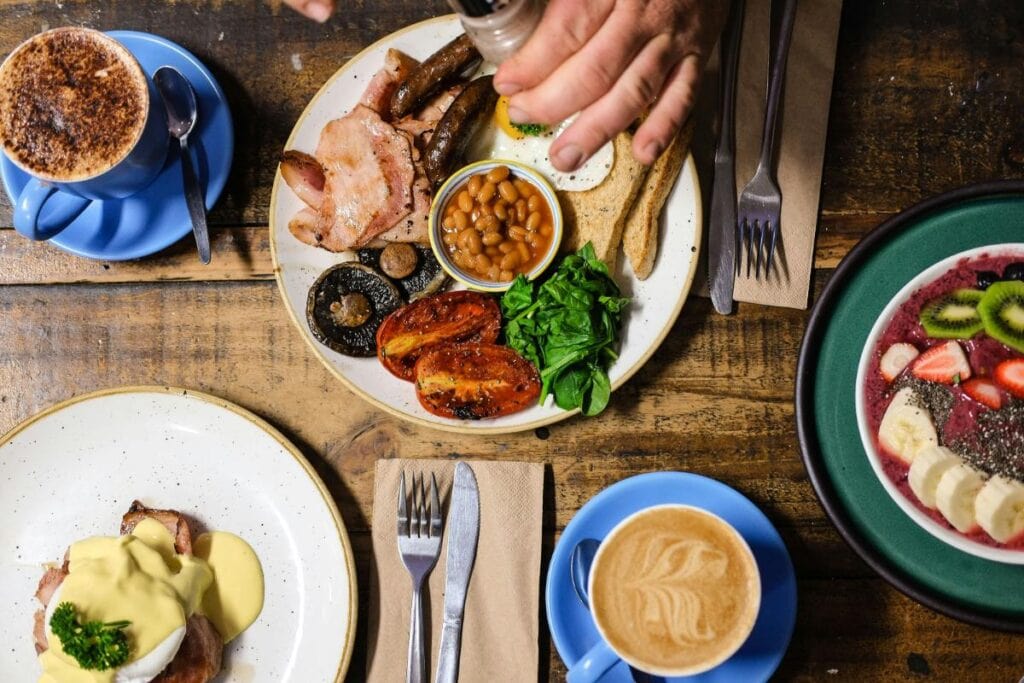 full breakfast spread on wooden table