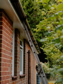 brick house in need of gutter repair