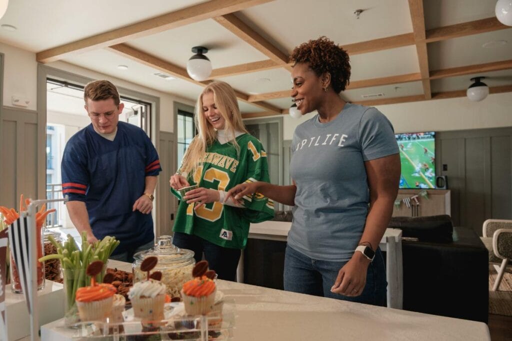 friends gathered to watch the game on tv