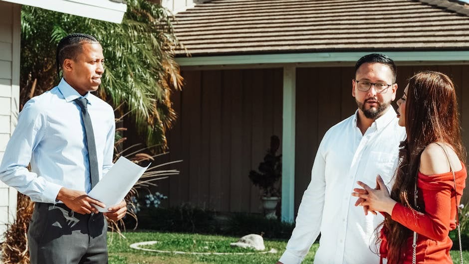 couple looking at a house with realtor