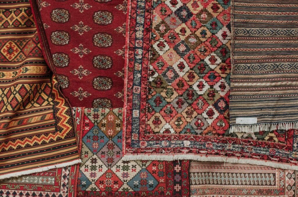 stack of colorful rugs