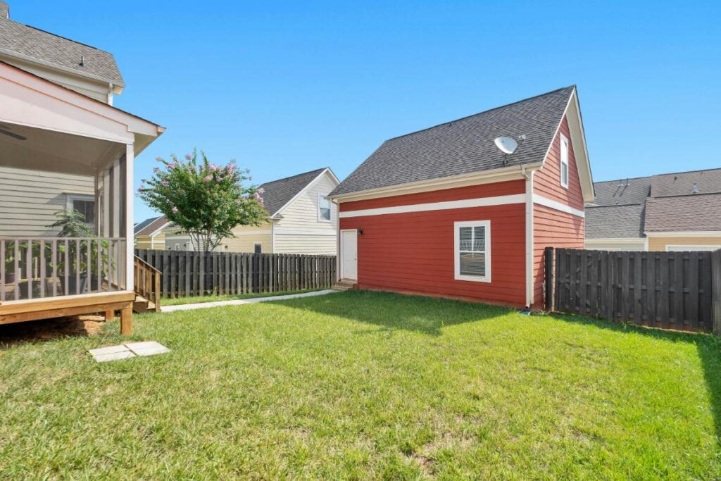 small backyard with a red out-building