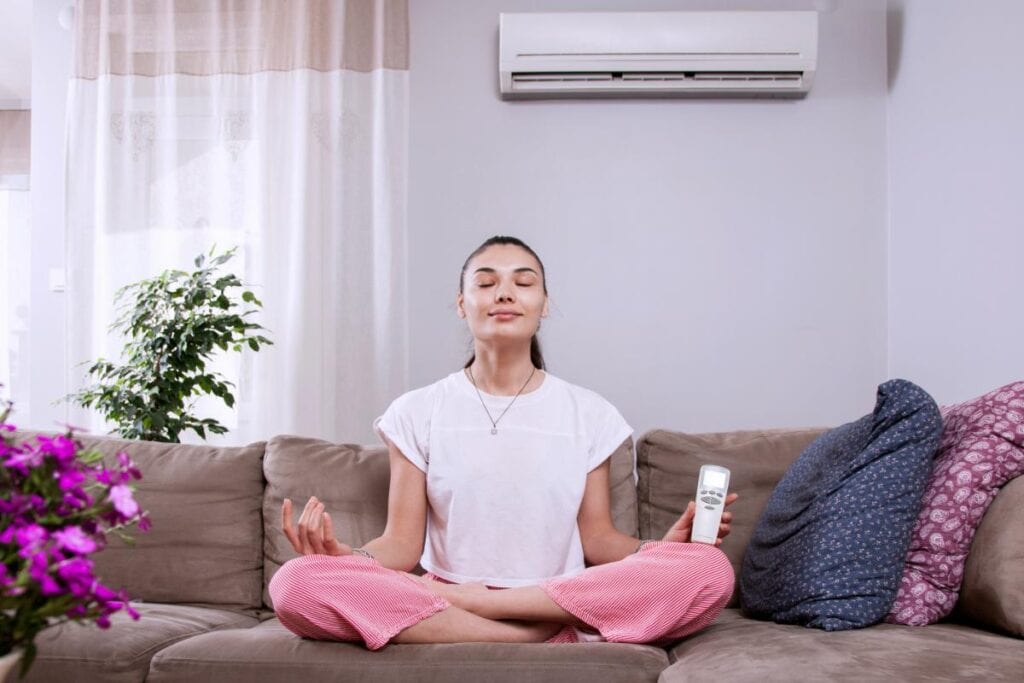 woman enjoying clean air in her home