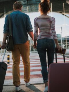 couple with luggage at airport