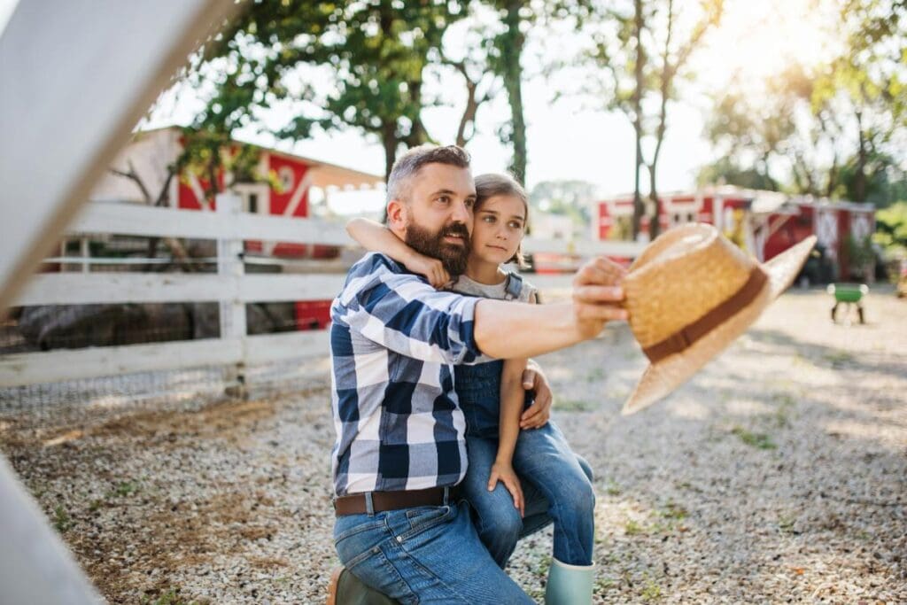 dad and daughter visiting farm or ranch