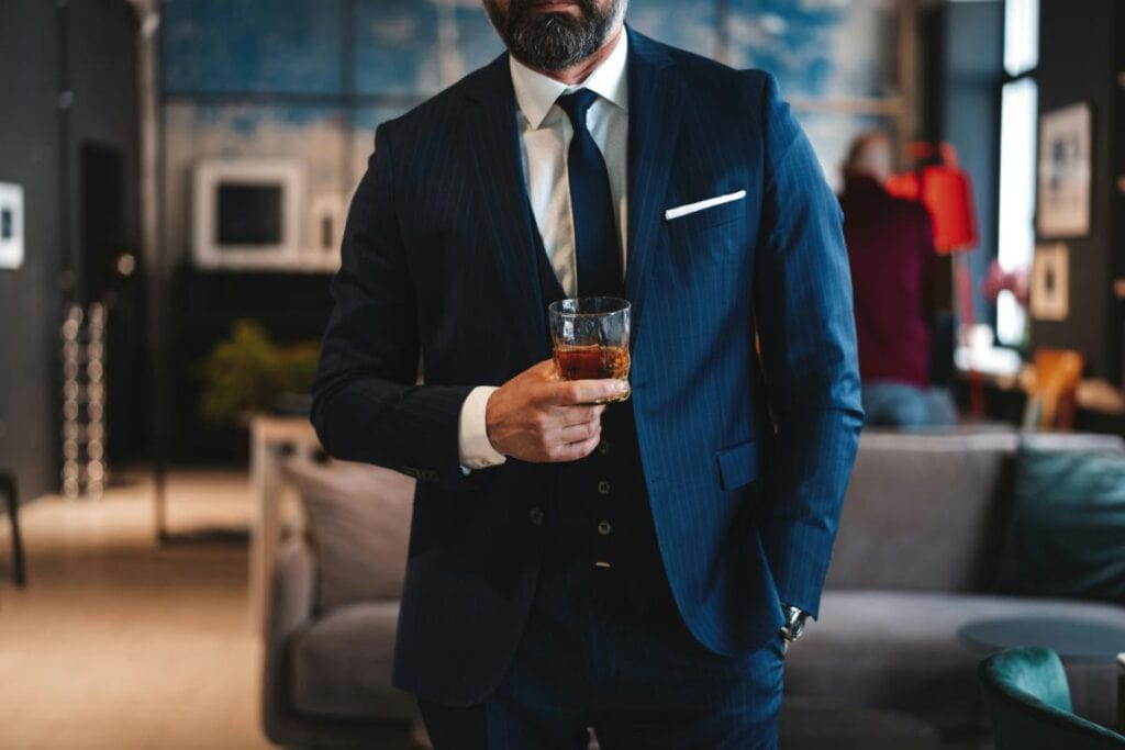 unidentified older gentleman in navy pinstripe suit