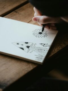 person drawing on a sketchpad