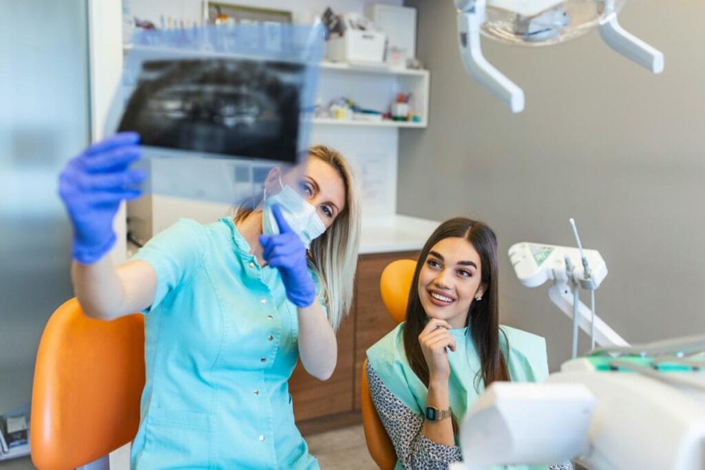 two women looking at dental xrays