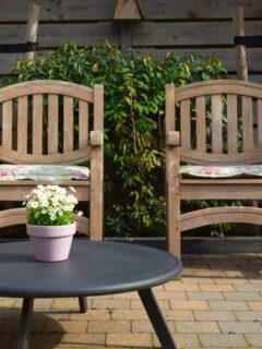 two chairs and small table on patio