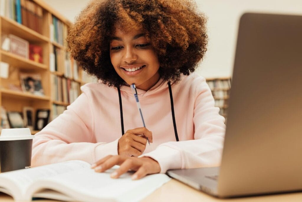 female college student studying in library