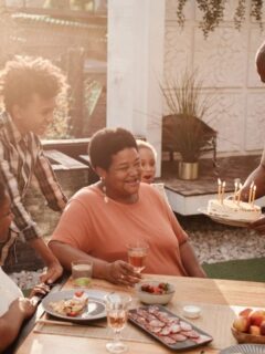 family outdoors celebrating someone's birthday