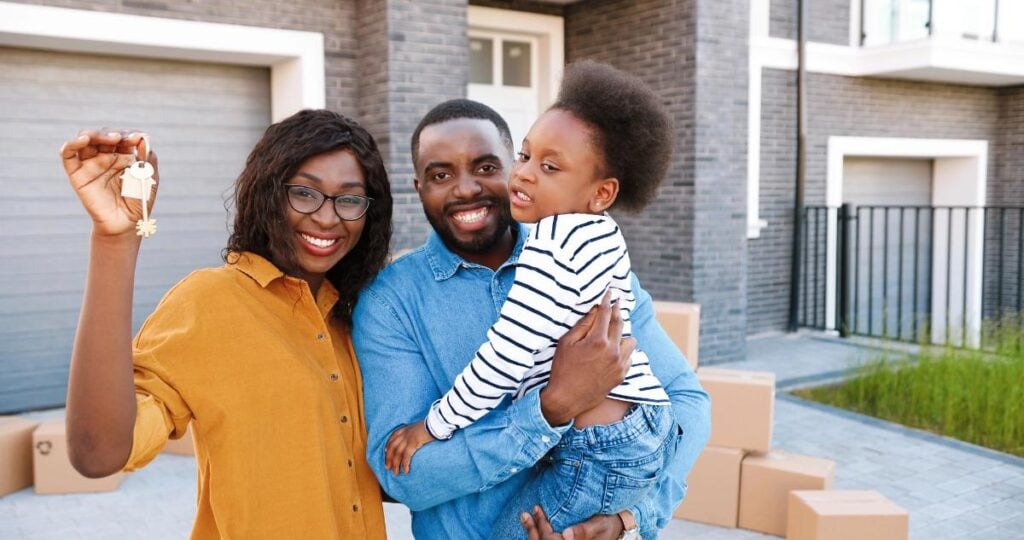 happy family with keys to new home